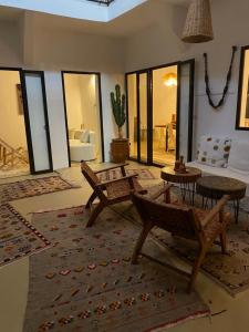 a living room with a couch and a table at Riad 24 in Marrakech