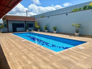 a swimming pool in front of a building at Sleep Inn Manaus in Manaus