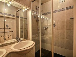 a bathroom with a glass shower and a sink at Grand appartement au pied des pistes avec balcon, pour 6 personnes - FR-1-455-40 in La Plagne +12 photos