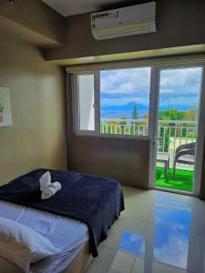 Katil atau katil-katil dalam bilik di L&J Cozy Little Nest at SMDC Wind Residences Tower5