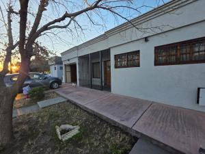 a house with a car parked in front of it at Casa nueva centrica in San Rafael