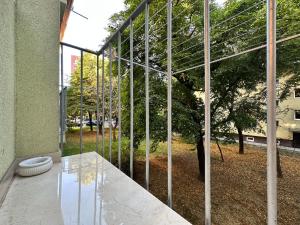 a glass facade of a building with a toilet at Mileticova street, keyless, AC in Nivy