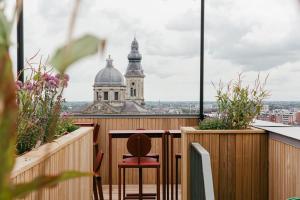 a balcony with a view of a cathedral at JAM Ghent in Ghent