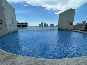 Bazén v ubytování elegante y moderno loft rodadero nebo v jeho okolí