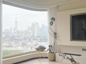Nespecifikovaný výhled na destinaci Šanghaj nebo výhled na město při pohledu z apartmánu