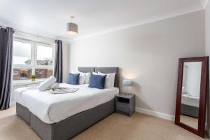 Ένα ή περισσότερα κρεβάτια σε δωμάτιο στο Carrick Retreat - Donnini Apartments