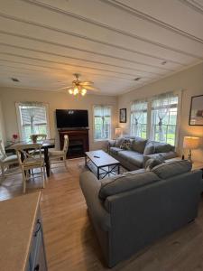 a living room with a couch and a table at Belle of the Burg in Hattiesburg