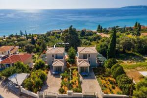 an aerial view of a house with the ocean at Villa Leanda by Villa Plus in Lourdhata
