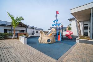 a playground with a slide and a play equipment at Ballito Hills 164 in Ballito