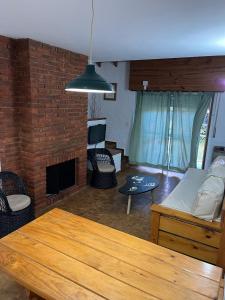 a living room with a couch and a table at Apartamento Calamar I in Valeria del Mar