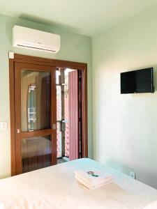 Μια τηλεόραση ή/και κέντρο ψυχαγωγίας στο Hotel Girassol +21 φωτογραφίες