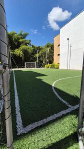 a soccer field with a goal on it at Apartamento Vacacional a 5min del Aeropuerto - Con 3 Piscinas - 2 Jacuzzi - Sauna - 20 min Parque del Café - By Molca Travel in La Tebaida