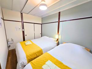 Ένα ή περισσότερα κρεβάτια σε δωμάτιο στο Osaka Riverside Inn