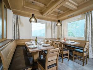 a dining room with a table and chairs at Chalet in Wald near Zillertal Arena in Königsleiten