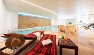a room with a swimming pool in the middle of it at Best Western Hotel Heide in Oldenburg
