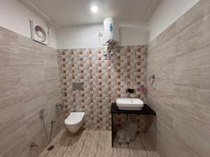 Koupelna v ubytování Hotel Ravindraya Residency