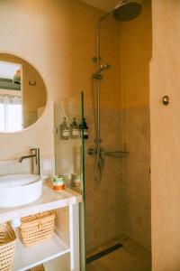 a bathroom with a shower and a sink at Flooka Surf & Yoga in Imsouane