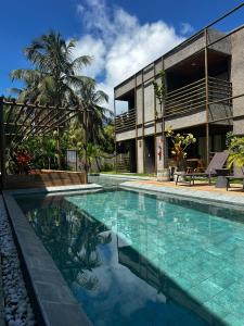 a large swimming pool in front of a building at Villa Kamby Milagres B003 in São Miguel dos Milagres