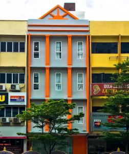a building with an orange stripe on the side of it at Elite Hotel KL Sentral in Kuala Lumpur