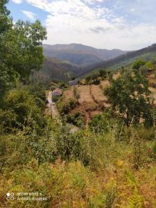 a view of a valley with mountains in the distance at Casa Meitriz in Castro Daire