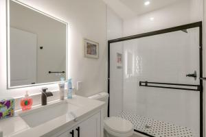 a bathroom with a shower and a sink and a toilet at Penthouse Condo with Rooftop Deck in Philadelphia! in Philadelphia +16 photos