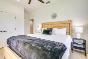 a bedroom with a large bed with a wooden headboard at Stylish Brownsville Stay Coastal Day Trips! in Brownsville
