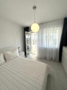 Ένα ή περισσότερα κρεβάτια σε δωμάτιο στο Olympus Residence 5