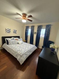 a bedroom with a bed and a ceiling fan at Backyard Oasis in Bradford +26 photos