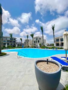 a view of a swimming pool at a resort at 4 Bedrooms Penthouse Villa, Marassi in El Alamein +47 photos