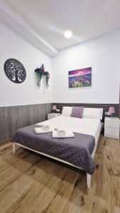 En eller flere senge i et værelse på OTEIZA