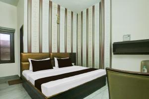 Ένα ή περισσότερα κρεβάτια σε δωμάτιο στο Hotel O J Classic