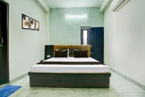 Ένα ή περισσότερα κρεβάτια σε δωμάτιο στο Hotel O J Classic