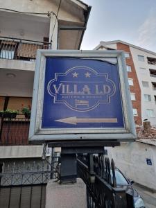 a sign for a milliliter at Villa LD in Skopje