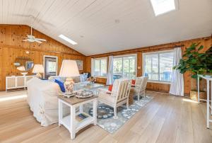 a living room with a couch and a table at High Tides - D3850 in Duck