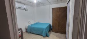 Ένα ή περισσότερα κρεβάτια σε δωμάτιο στο Restaurante y Hostal Pueblo Escondido