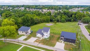 an aerial view of a house with a yard at Lakeside Landing - Near Ark - with Hot Tub in Dry Ridge