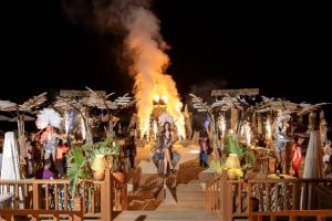 a fire show with a man on a horse on a stage at Titanic Luxury Collection Bodrum in Guvercinlik