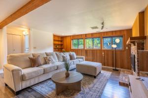 a living room with a couch and a table at 5BR Gem Walk to Microsoft and Near Redmond DT in Redmond +40 photos