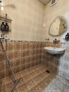 a bathroom with a sink and a mirror at Podslon Varna Vibes in Varna City +11 photos