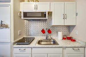 a kitchen with a sink and a microwave at Hike and Bike On-Site Burgaw Apt - 4 Mi to River in Burgaw +17 photos