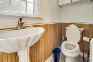 a bathroom with a sink and a toilet at Hike and Bike On-Site Burgaw Apt - 4 Mi to River in Burgaw