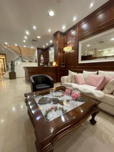 a living room with a couch and a coffee table at Hotel San Sebastián Hospedería in Cieza