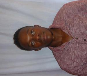 a young black man in a red shirt at Flex Zone in Nairobi