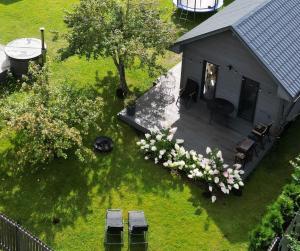 an overhead view of a backyard with a house at Kursīšu namiņš in Skulte