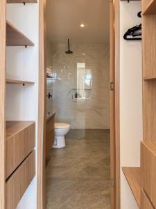 a bathroom with a toilet and a sink at Villa Milá in Salento +51 photos