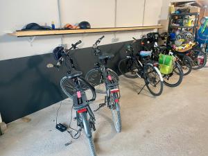 a group of bikes parked in a garage at Fewo 3 - Seehaus Hoyer in Gunzenhausen