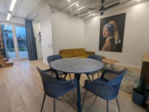 a living room with a table and chairs and a couch at Svencele K12 in Svencelė