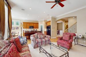 a living room with a couch and two chairs at Cascade Escape in Renton