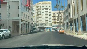 a view of a city street with cars and buildings at Apartment Centre Meknes in Meknès