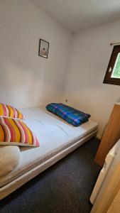 a bedroom with two beds in a room at Appartement Pied Des Pistes in La Toussuire +14 photos